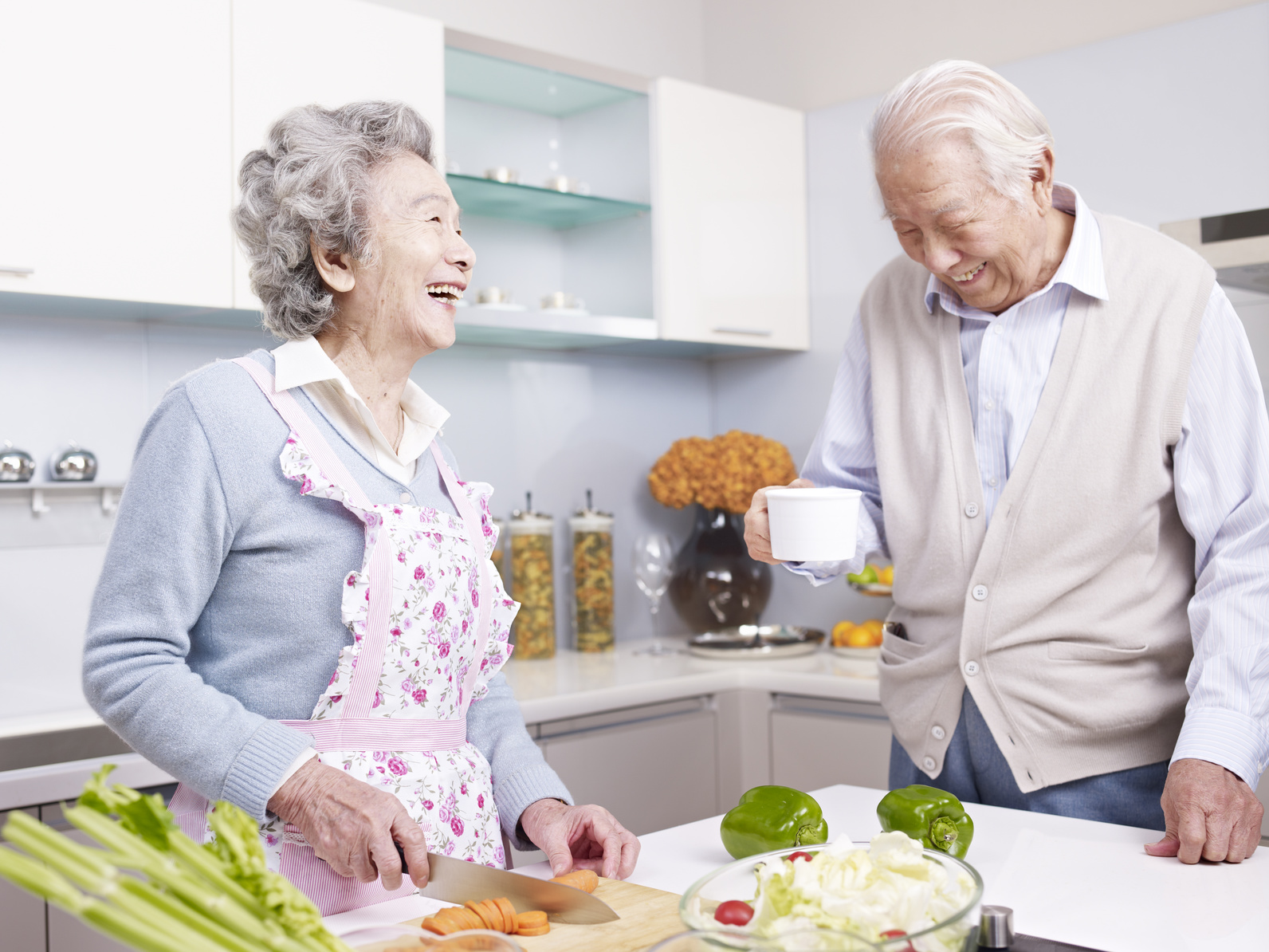 senior couple talking in kitchen